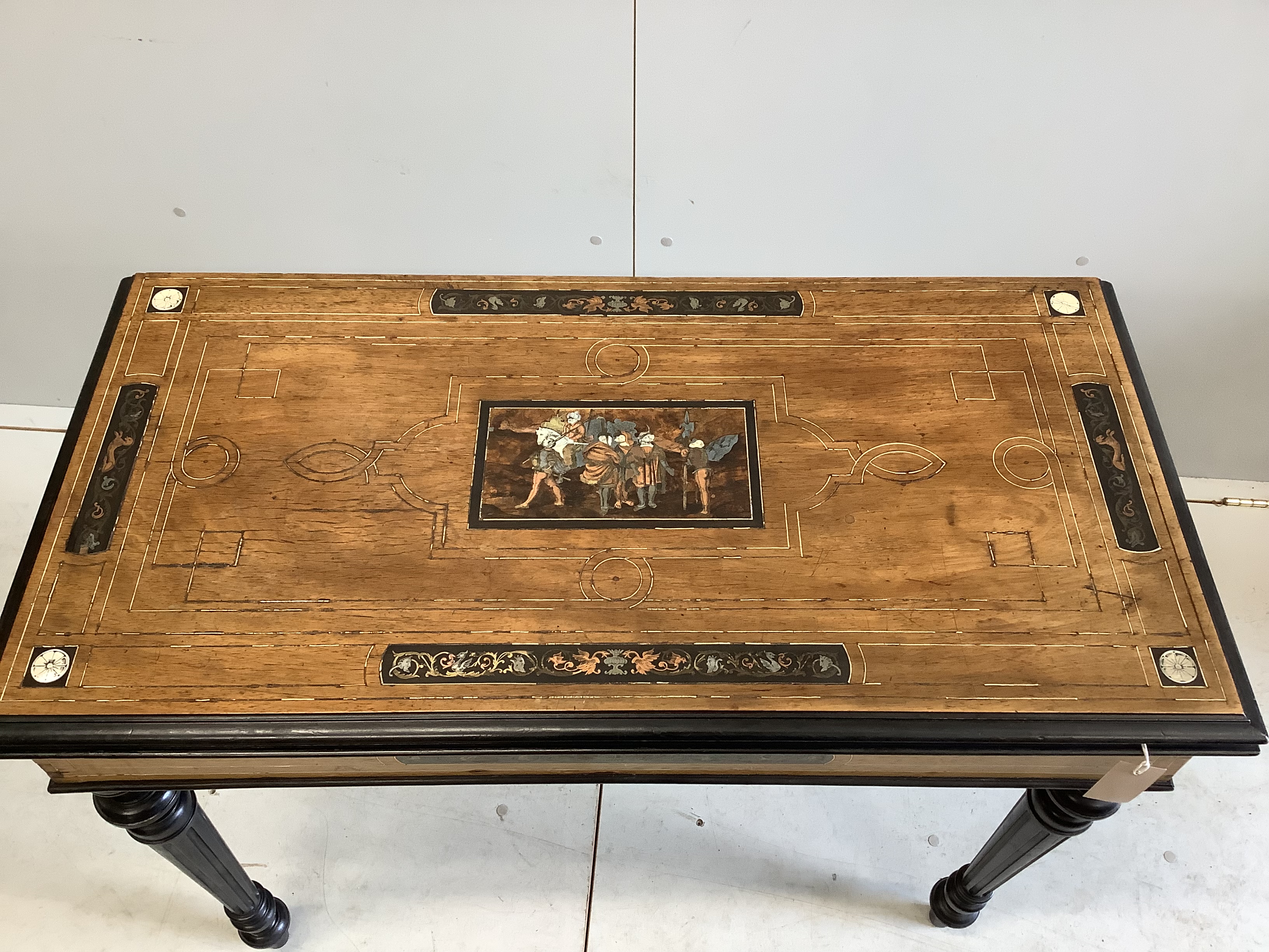 A late 19th century Italian copper, brass and bone marquetry inlaid walnut and ebonised folding card table, width 94cm, depth 46cm, height 75cm